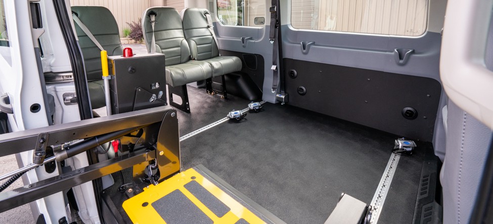 Wheelchair lift and securement systems